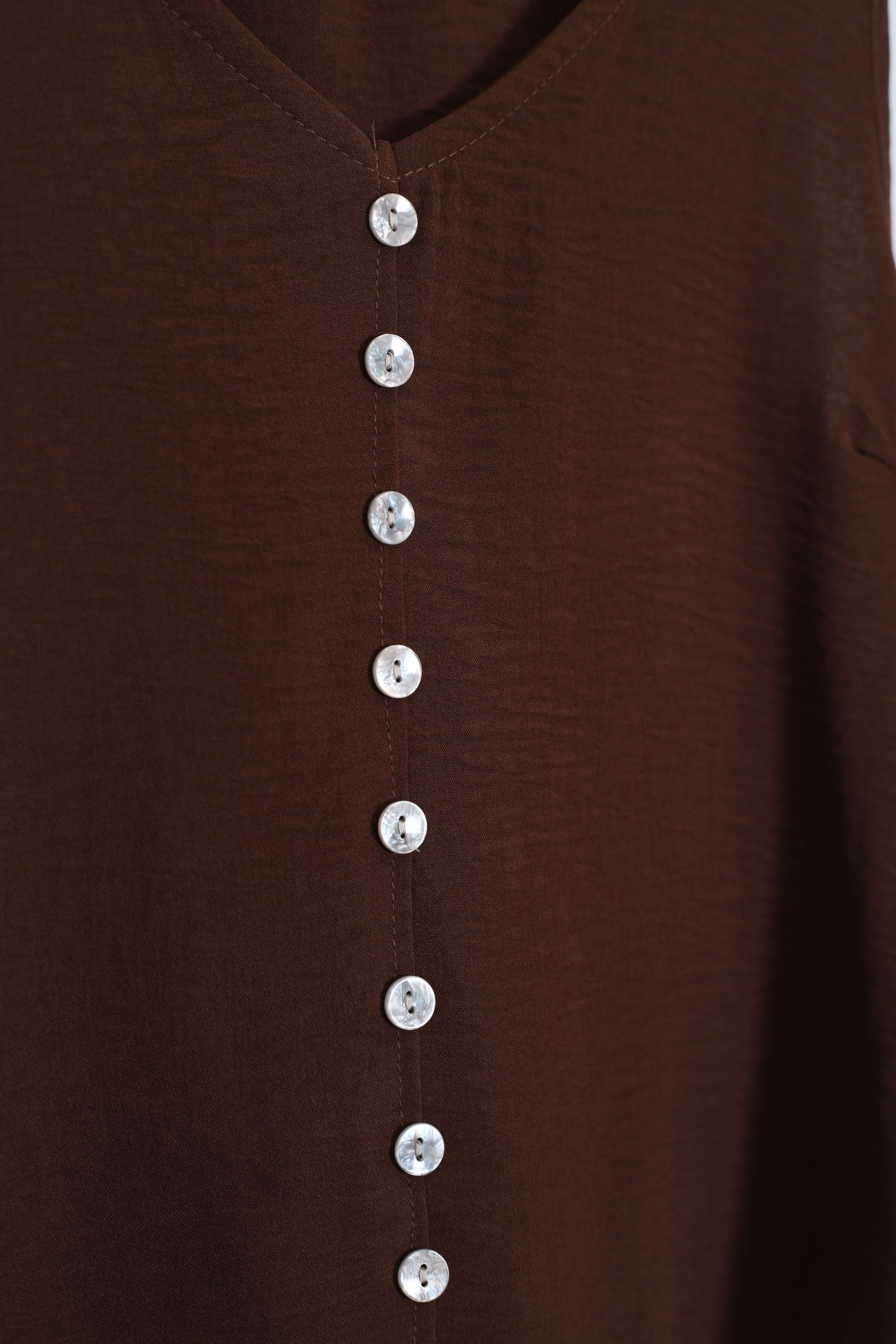 Top fluido botones
