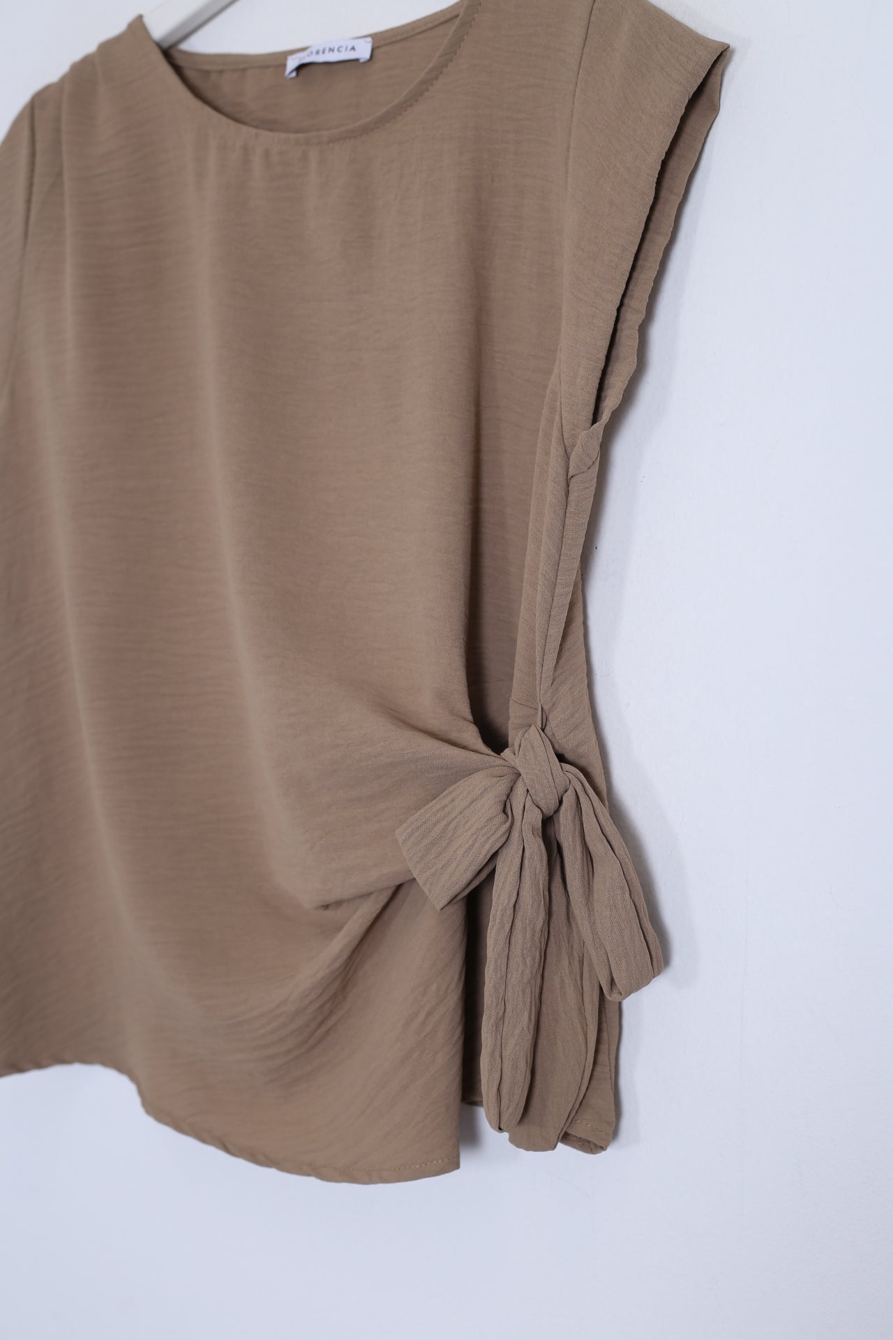 Top nudo fluido