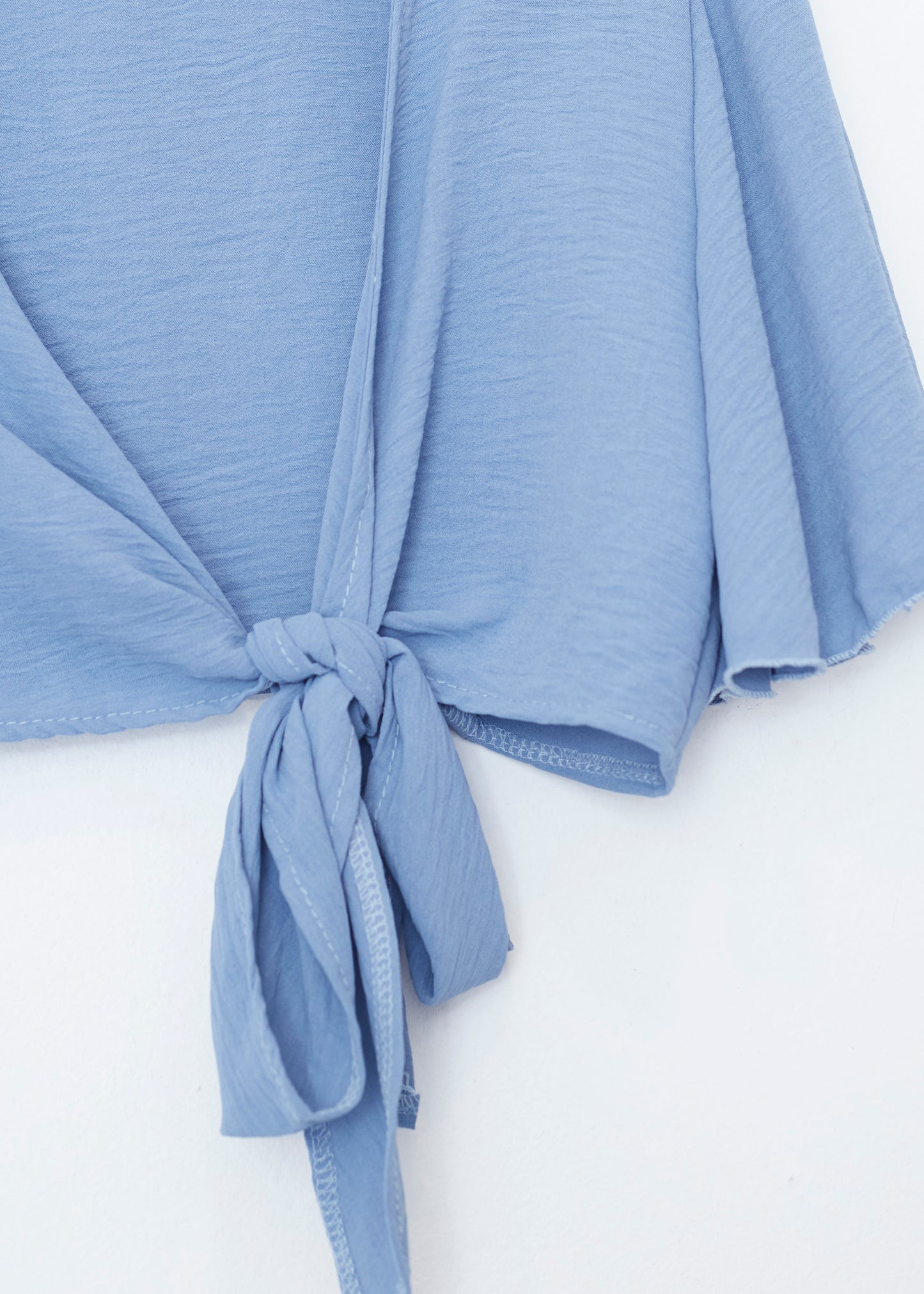 Flowing bolero with bow