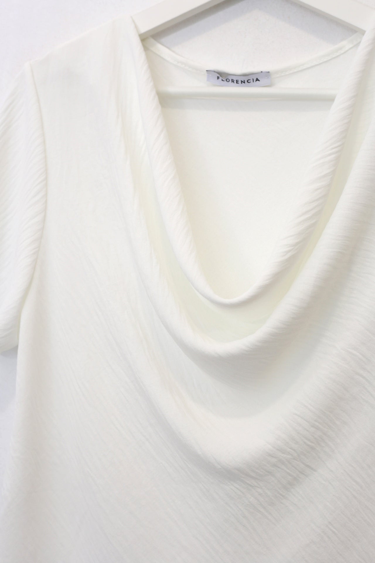 Blusa desbocada fluida