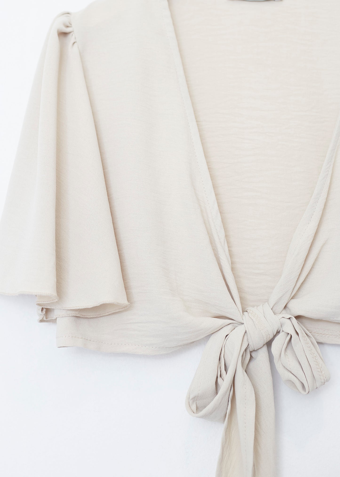 Flowing bolero with bow