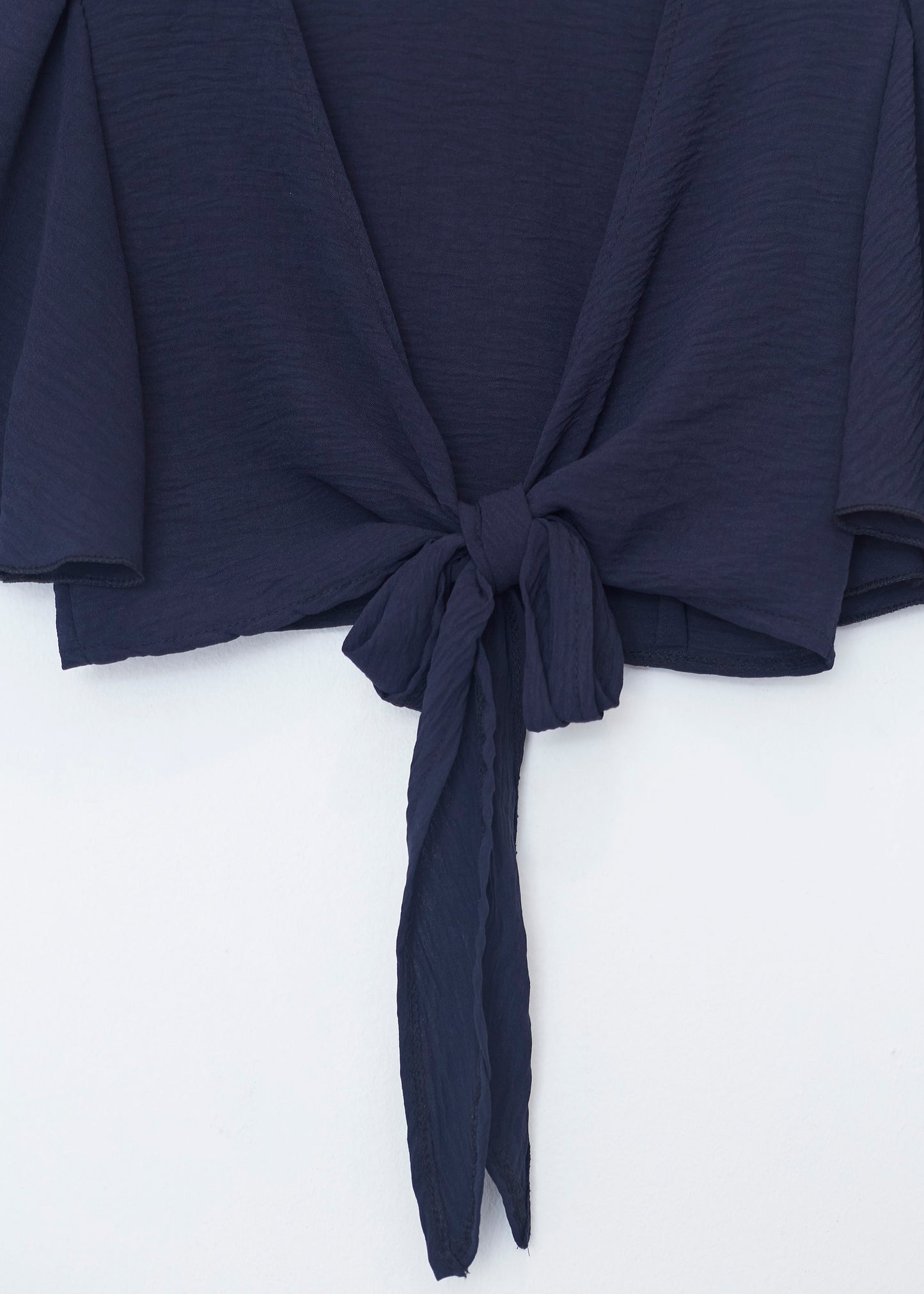 Flowing bolero with bow