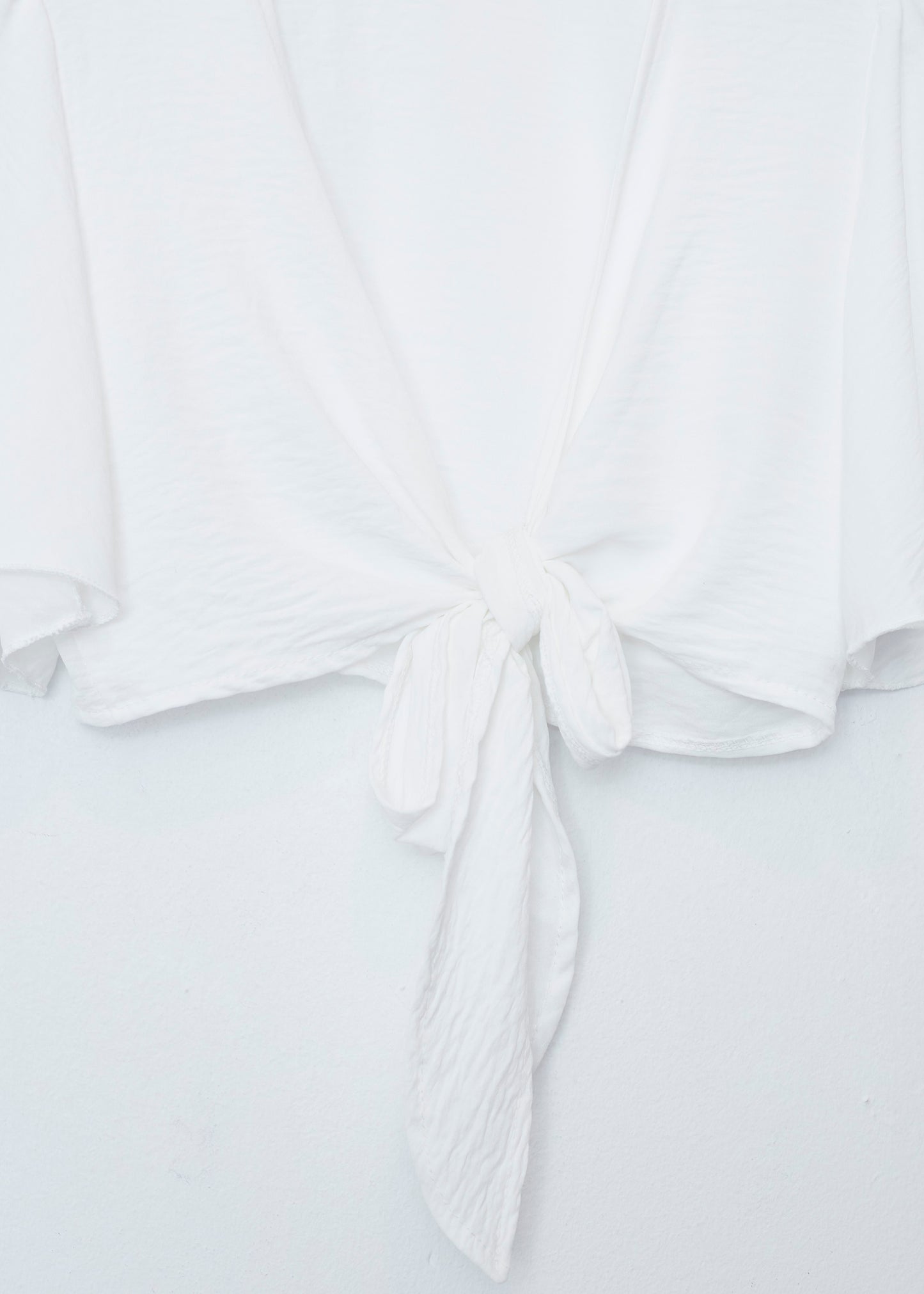 Flowing bolero with bow