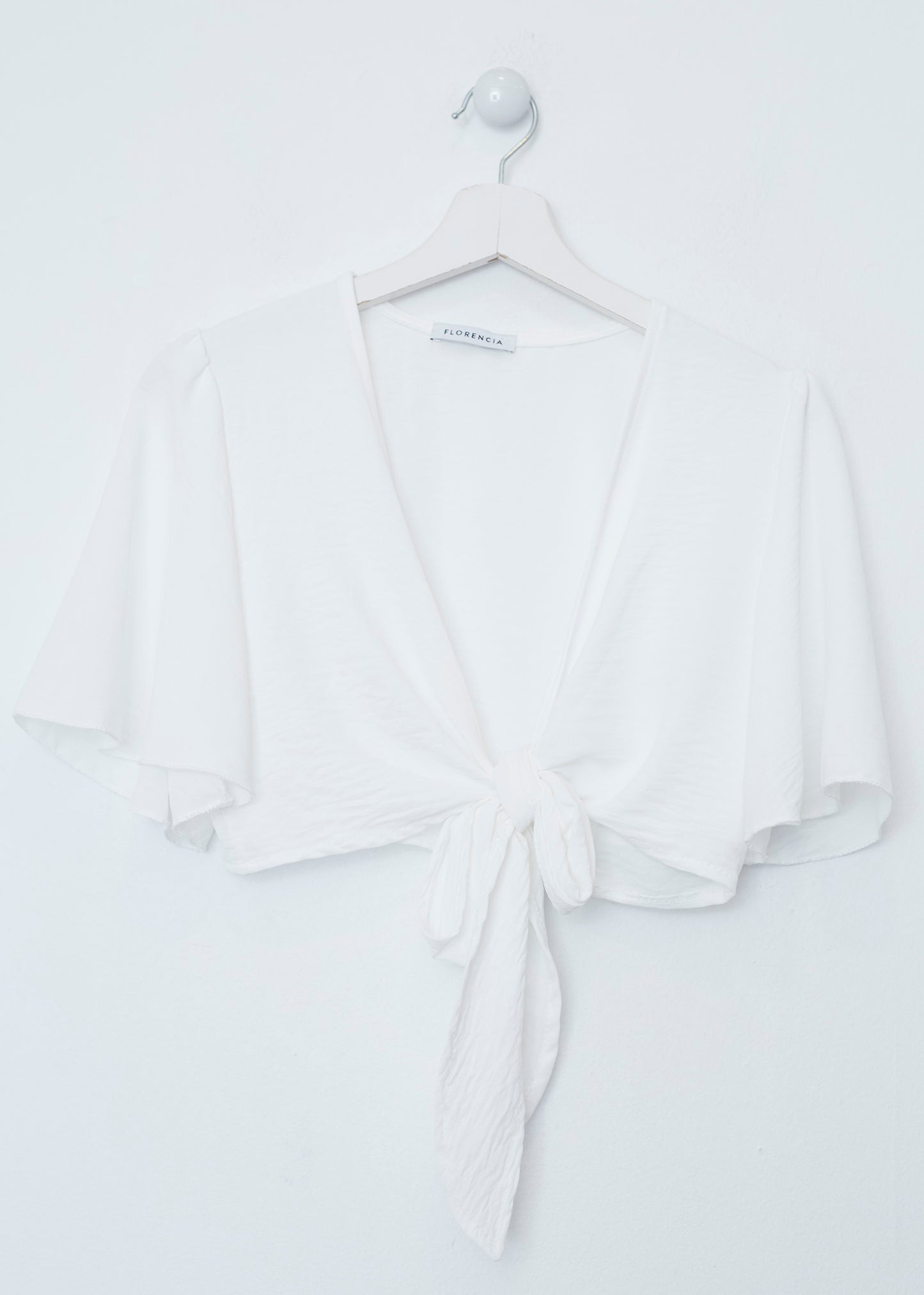 Flowing bolero with bow