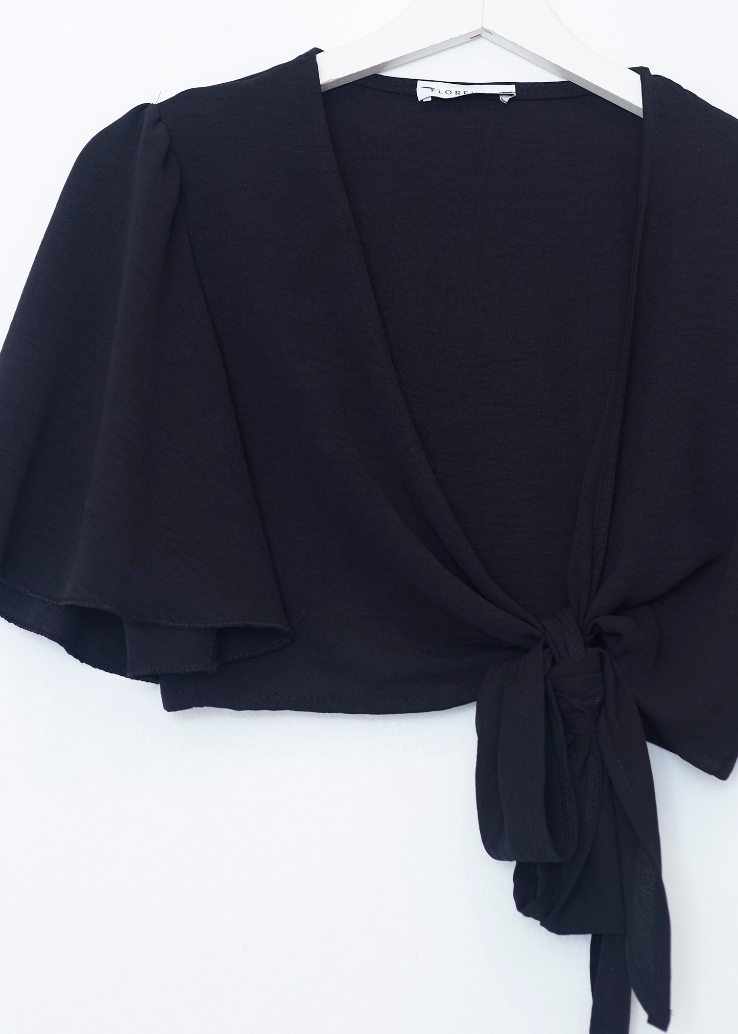 Flowing bolero with bow