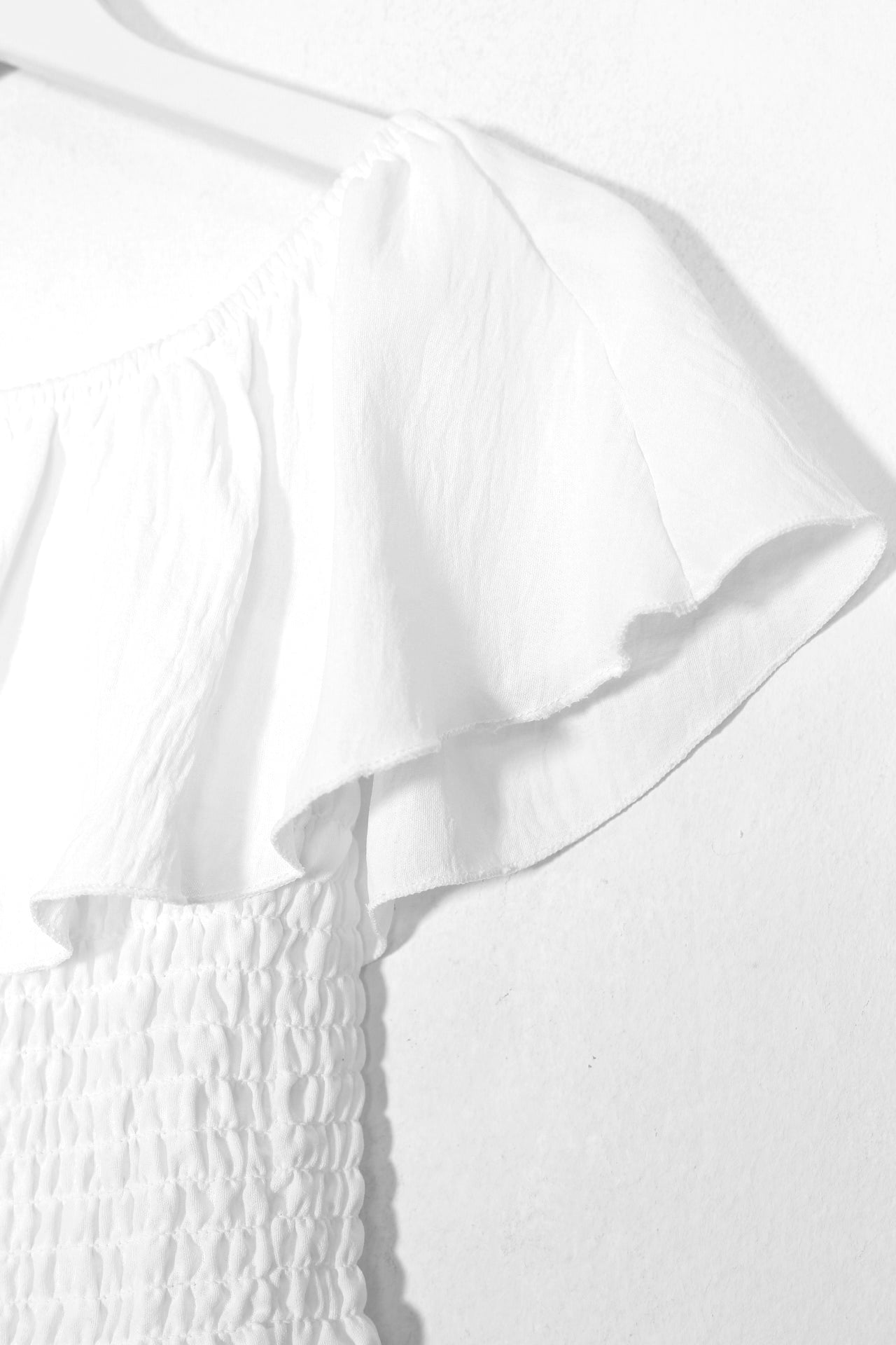 Top fluido volante fruncido